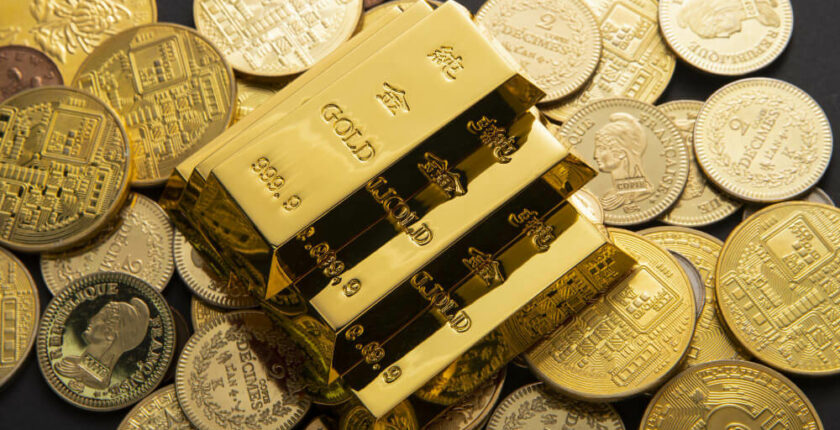 closeup-shot-pile-shiny-gold-coins-bars