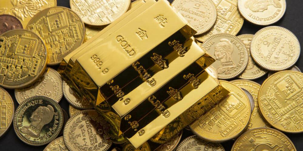 closeup-shot-pile-shiny-gold-coins-bars