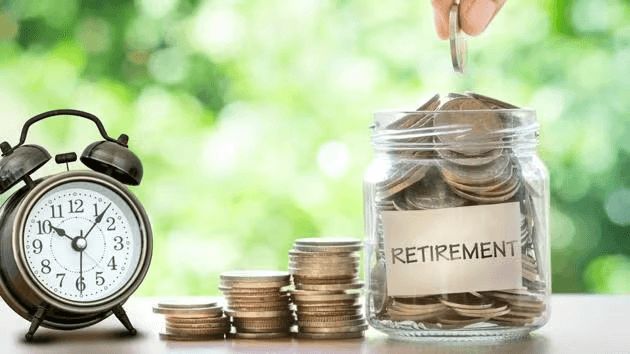 coins being put and saved in a jar