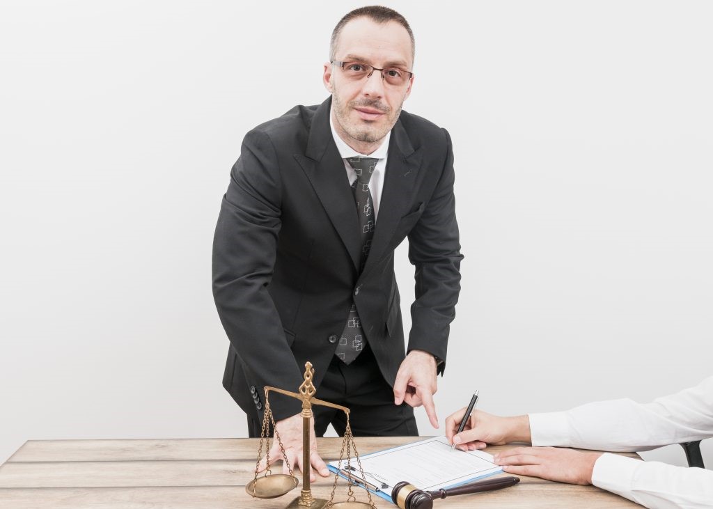 lawyer pointing to legal papers