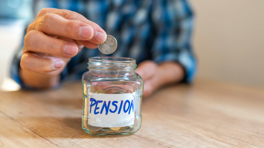 man putting a coin in a jar that is labelled pension