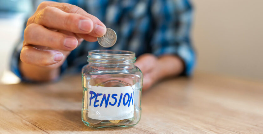 man putting a coin in a jar that is labelled pension