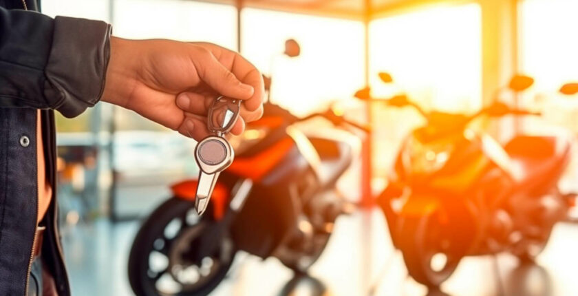 man with keys in a bike showroom